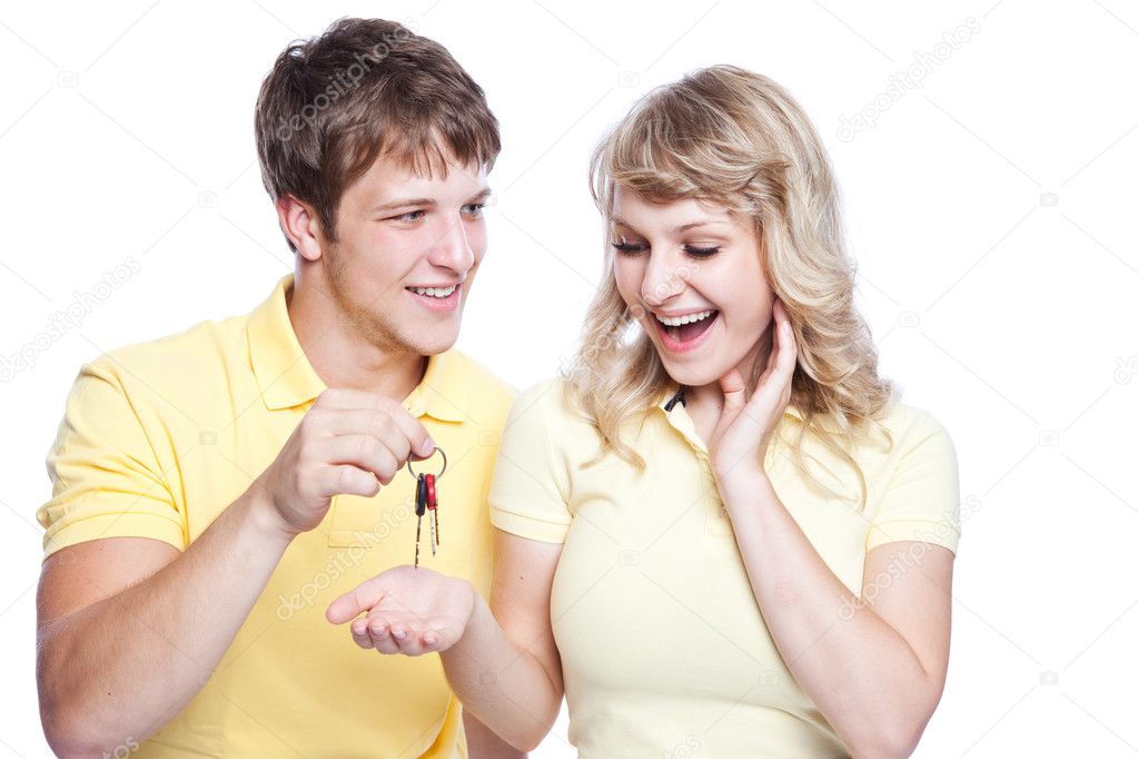 Young couple holding a set of keys