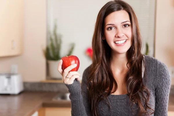 Woman holding apple — Stock Photo, Image