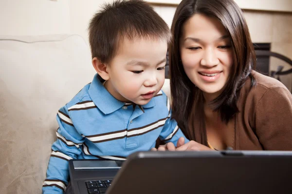 Mother and son with laptop — Stock Photo, Image