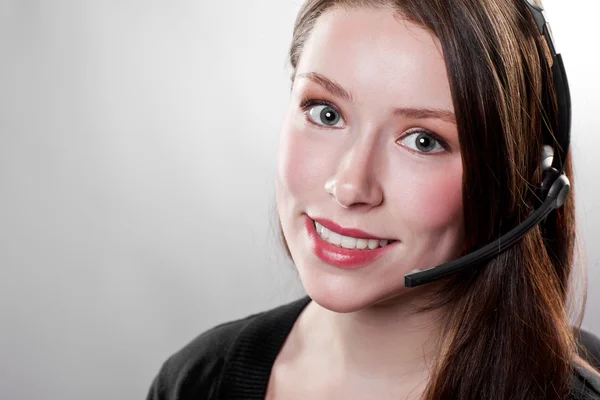 Businesswoman wearing a headset — Stock Photo, Image