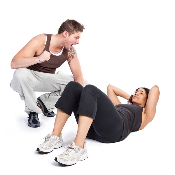 Упражнение женщина с тренером — стоковое фото