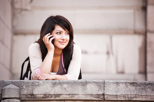 Mixed race student on the phone — Stock Photo, Image