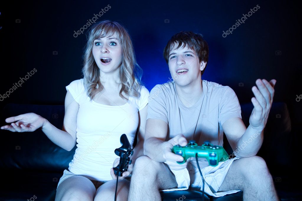 Couple playing video games — Stock Photo © aremafoto 5655069