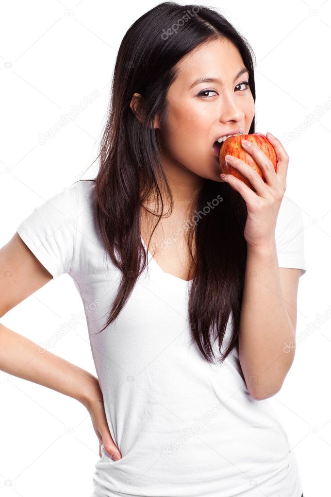 Asian woman eating apple