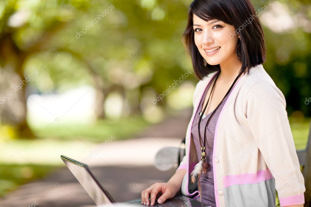Mixed race college student with laptop
