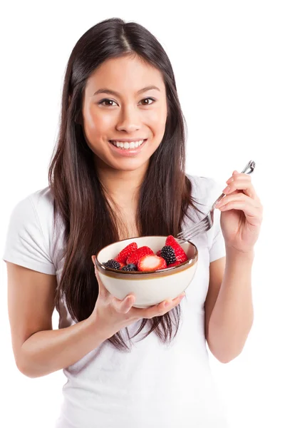 Asiatisk kvinna äta frukt — Stockfoto