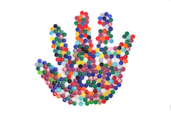 Tapas de plástico de color como mano — Foto de Stock