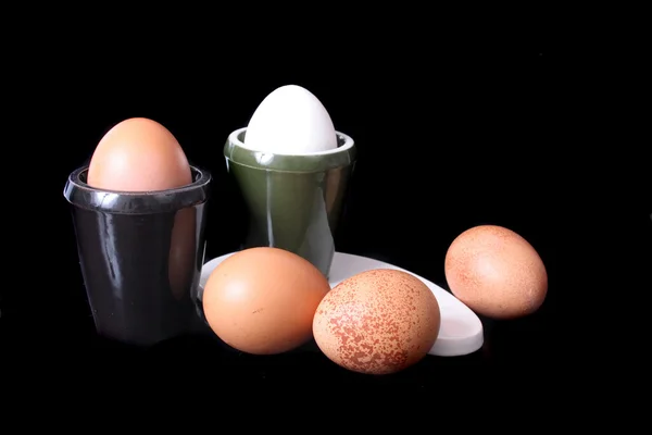 Eggs on black background — Stock Photo, Image