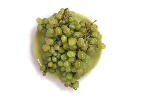 Groene druiven op plaat — Stockfoto