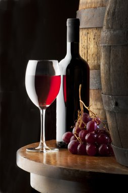 Still life with red wine on table clipart