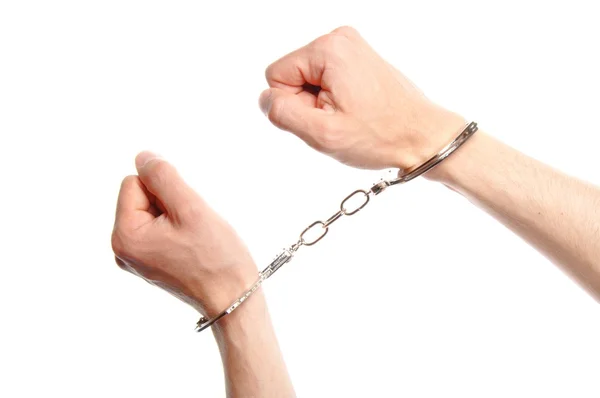 Hand wearing handcuffs — Stock Photo, Image