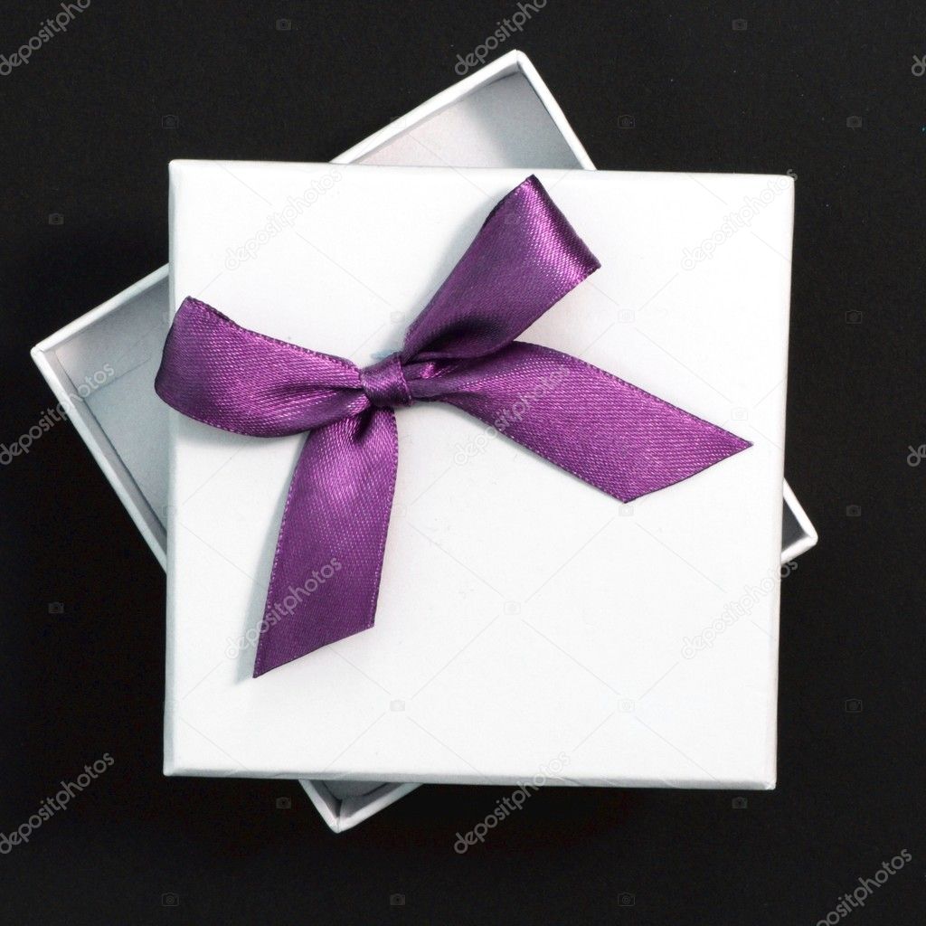 White gift with purple ribbon