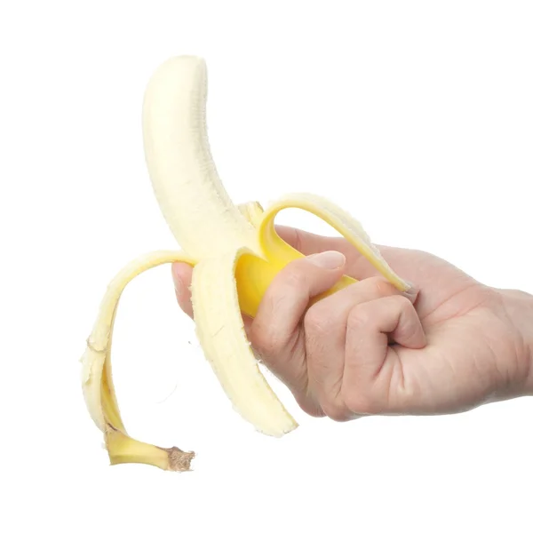 Ruka drží banán — Stock fotografie