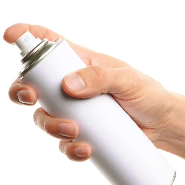 Ręka trzyma spray — Zdjęcie stockowe