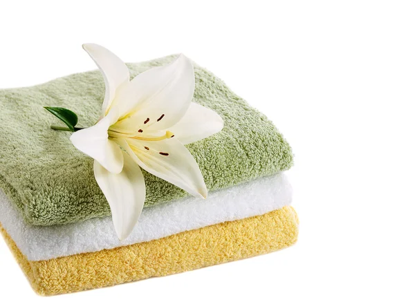 Towels with white lily Royalty Free Stock Images