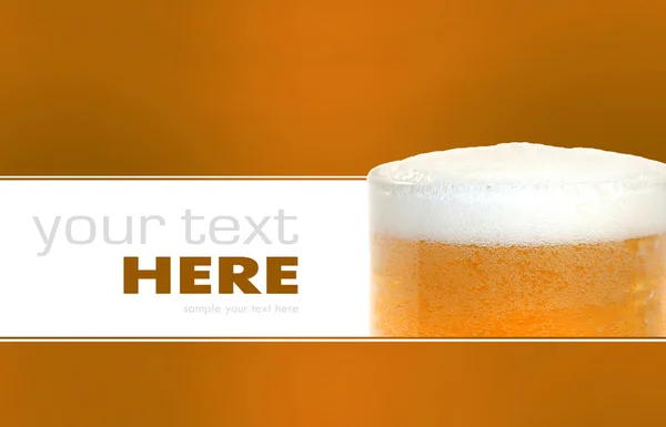 stock image Glass of beer closeup with froth isolated on a background