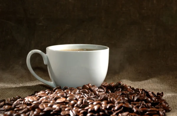 Coffee cup and grain — Stock Photo, Image