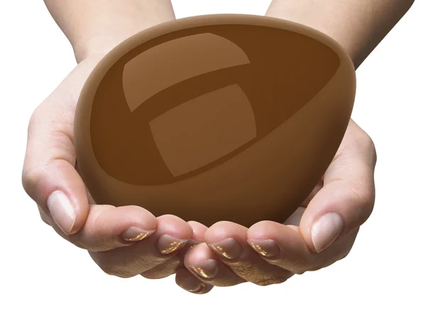 Ovo de chocolate + mãos — Fotografia de Stock