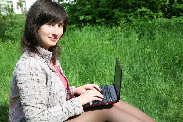 Young woman with netbook — Stock Photo, Image