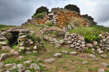 Ruins of ancient culture Sardinia Nuraghe tower clipart