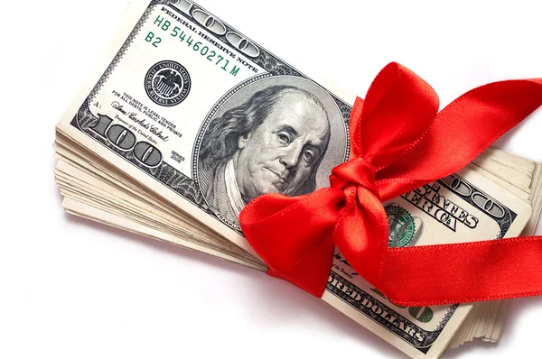 Dollars with red ribbon isolated on white — Stock Photo, Image