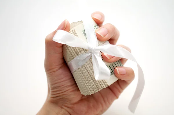 Dollar roll in hand — Stock Photo, Image