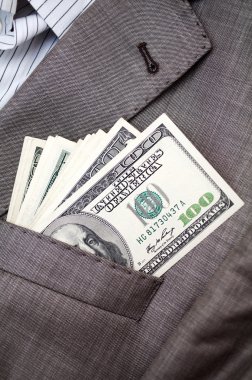 Dollars in the pocket of business suit clipart