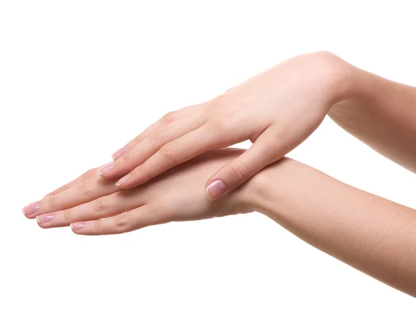 Hermosas manos femeninas están aisladas sobre un fondo blanco — Foto de Stock