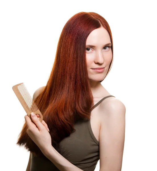 Portrait of a beautiful young woman comb wonderful hair — Stock Photo, Image
