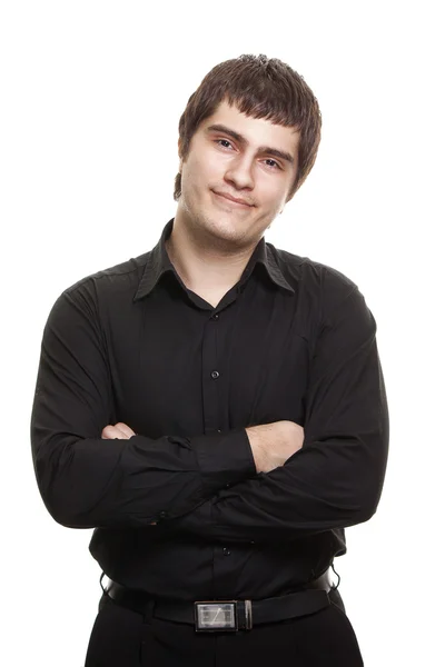 Jonge man in zwarte shirt glimlachend geïsoleerd op witte achtergrond — Stockfoto