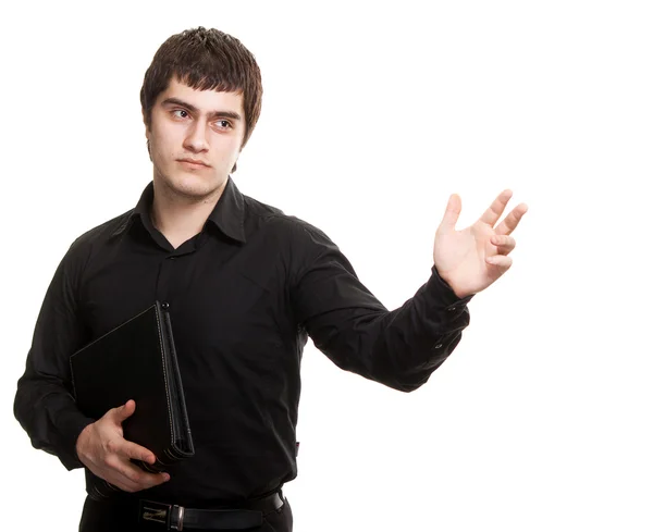 Homem sério na camisa preta com livro isolada em background branco — Fotografia de Stock