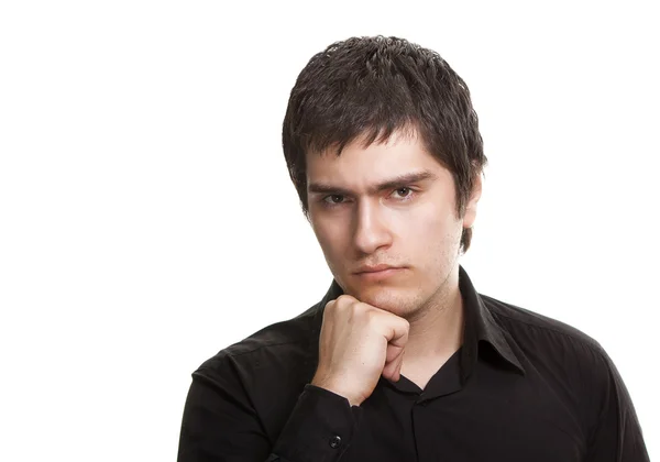Young frustrated man in black shirt isolated on white background — Stock Photo, Image