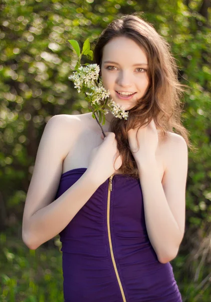 Young teen girl with flower outdoor — Stock Photo, Image