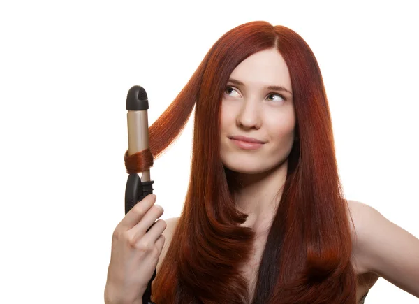 Beautiful woman curling long hair isolated — Stock Photo, Image