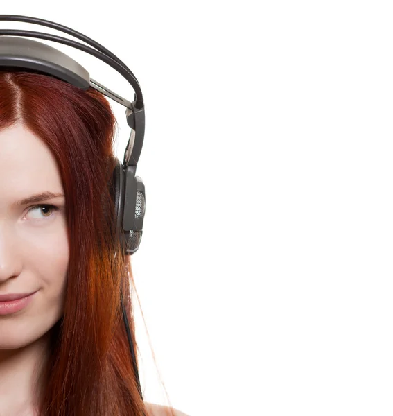 Beautiful young woman with headphones look on copyspace — Stock Photo, Image