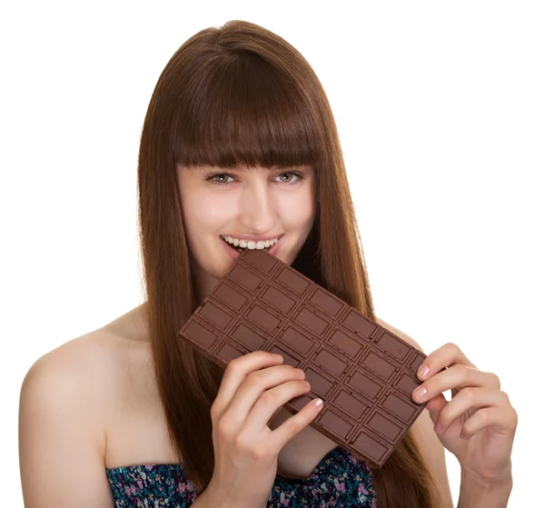 Foto de una hermosa joven con gran barra de chocolate — Foto de Stock