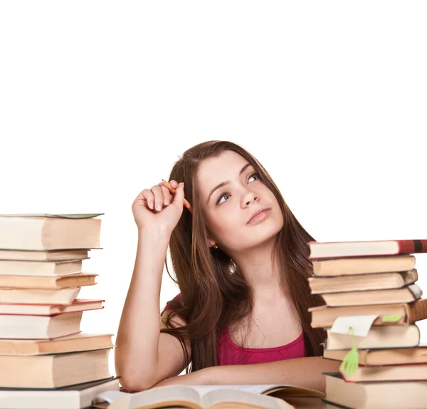 Teenie-Mädchen lernen am Schreibtisch, mit vielen Büchern herum, isolat — Stockfoto
