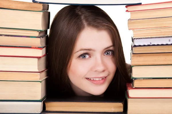 Dospívající dívka s mnoho knih, kolem, izolované na bílém — Stock fotografie