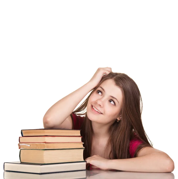 Девочка-подросток с большим количеством книг, изолированных на белом — стоковое фото