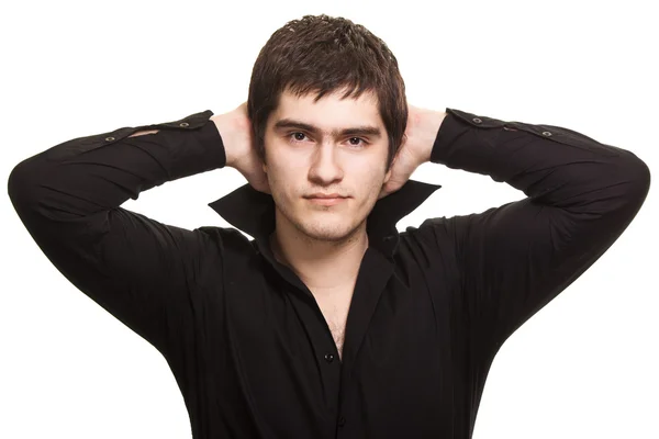 Mladý muž v černé košili izolovaných na bílém pozadí — Stock fotografie