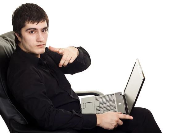 Young man, sitting on a chair with laptop. isolated on white bac — Stock Photo, Image