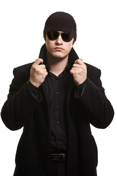 Confidence man in black coat and sunglasses — Stock Photo, Image
