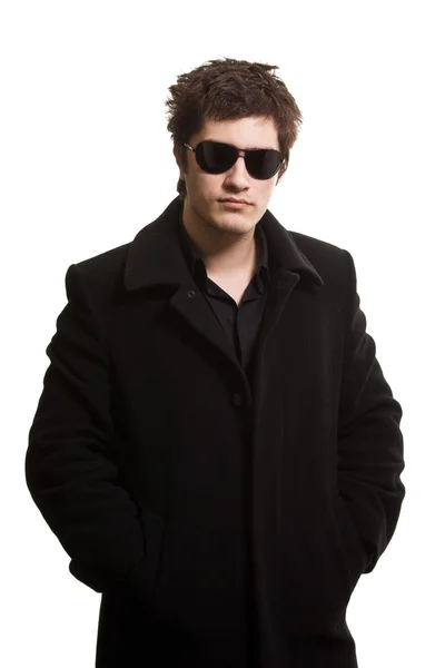 Confidence man in black coat and sunglasses — Stok Foto