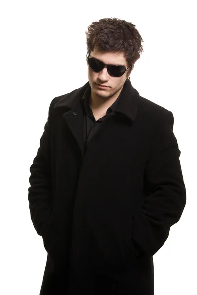 Confidence man in black coat and sunglasses — Stock Photo, Image
