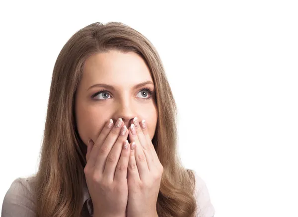 Portrait of a surprised young woman with hands over her mouth la Stock Image
