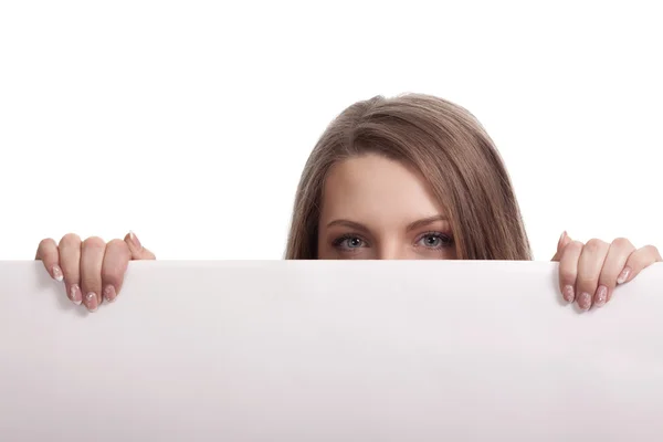 Woman looking over blank card in the studio Stock Picture