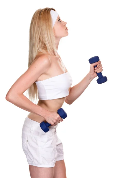 Portrait of a sporty woman with a dumbbell on white background — Stock Photo, Image