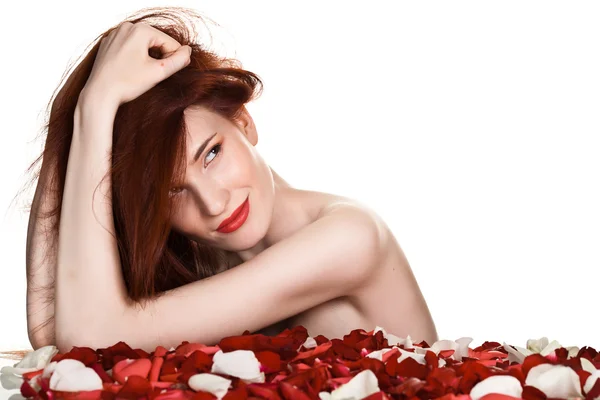 Beautiful woman and rose petals on white background — Stock Photo, Image