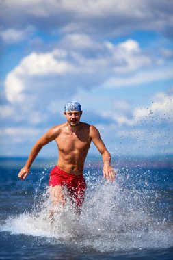 Man run on the sea clipart