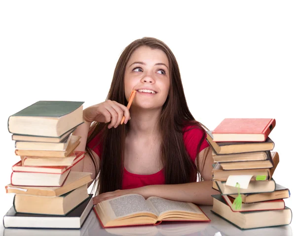 Tiener meisje met veel van boeken, geïsoleerd op wit — Stockfoto